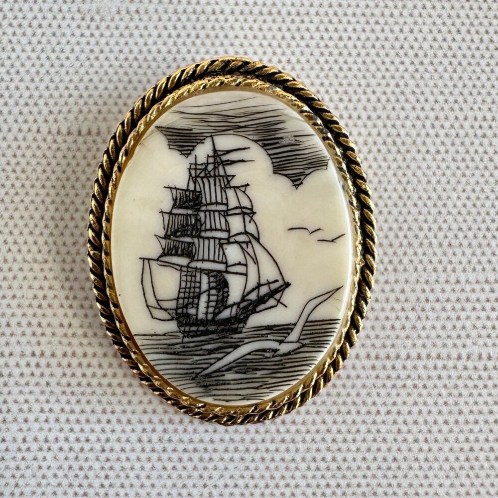 1970s Carved Bone Ship Brooch Pendant Goldtone Rope Frame 1.5 x 1.25 Inch